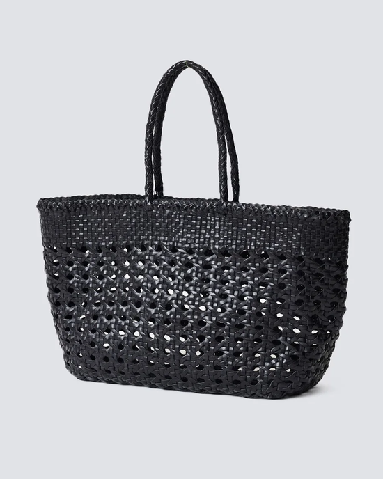 Cannage Kanpur Big in Black handwoven leather tote bag by Dragon Diffusion against a neutral background.