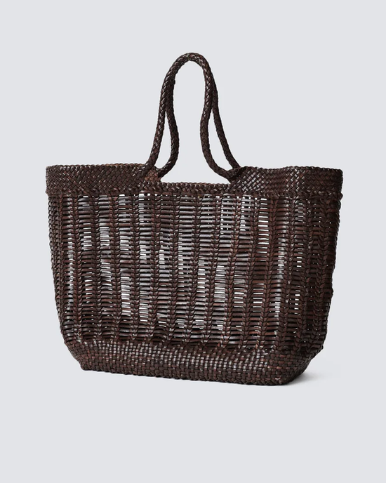 A Dragon Diffusion Window Basket in Dark Brown hand-woven tote bag against a neutral background.