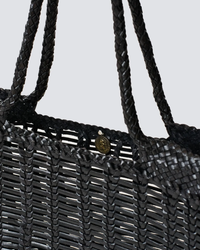 Close-up of a Dragon Diffusion Window Shopper in Black with braided handles and a metal clasp detail.