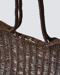 Close-up of a Dragon Diffusion Window Shopper in Dark Brown tote bag with braided handles, made of 100% leather.