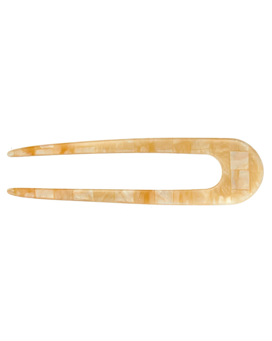 A Machete French Hair Pin in Sea Shell Checker with a marbled design on a white background, crafted from Italian acetate.