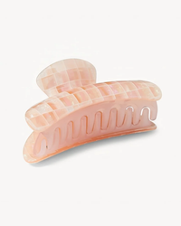 A pastel pink, checkered Italian acetate Machete Grande Heirloom Claw hair clip in Apricot Shell Checker on a white background.