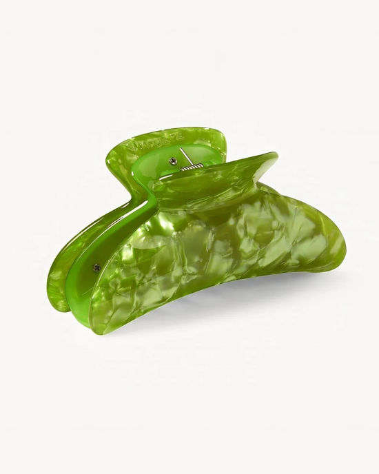 Green, glossy, Grande Heirloom Claw in Pistachio-shaped sculpture against a white background, crafted from Italian acetate by Machete.
