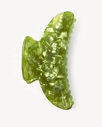 Green gummy bear isolated on a white background with a Machete Grande Heirloom Claw in Pistachio.