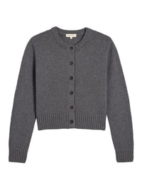 The Hallie Cotton Cashmere Cardigan in Dark Heather Grey by Demylee is a cropped, button-front cardigan inspired by the brand’s classic style.