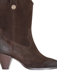 A close-up of a FRYE June Western in Chocolate leather cowboy boot with a small emblem on the side.