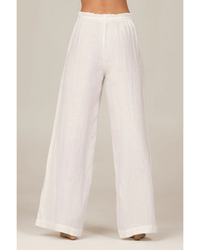 Woman standing in Bella Dahl Drawcord Wide Leg Pant in White made of 100% linen.