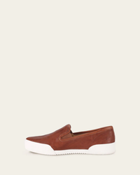 FRYE Mia Slip On in Cognac leather shoe with white sole against a neutral background.