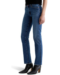 A person wears AG Jeans' Sandra Low Rise Straight in 15Ys Prague, paired with a black top and black heeled ankle boots, standing against a white background.