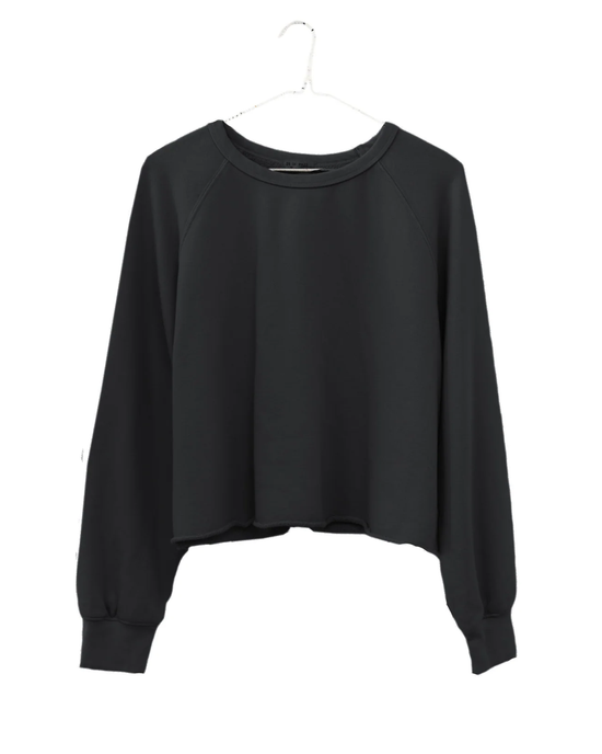 Raw Edge Crop Sweatshirt in Black by It is well LA on a hanger against a white background.