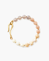 A Unity Bracelet in Sunstone Mix featuring alternating large sunstone and small translucent beads with an 18k gold plated sterling silver clasp, isolated on a white background by Chan Luu.