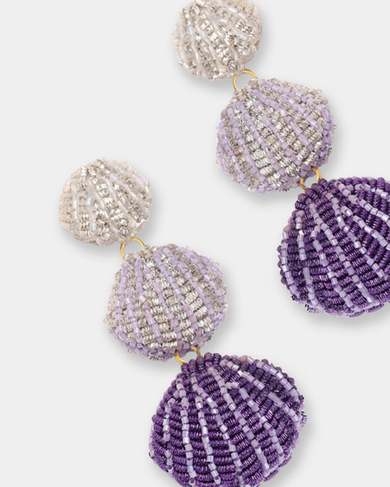 A collection of decorative, Venus Earrings in Purple jewelry-inspired seashell-shaped purses in purple and white colors by Olivia Dar.