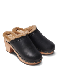 Pair of Woodpecker Mas Shearling in Black/Bronze clogs with genuine shearling lining and wooden soles featuring rivet details by beek.