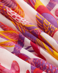 Colorful patterned 100% Cotton Inoui Editions Square 130 Cerise in Pink oversize bandana folds close-up.