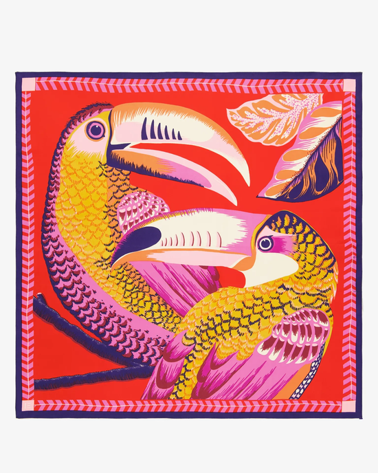 Vibrant illustration of two stylized parrots in bold colors on a red background, reminiscent of an Inoui Editions Square 65 Toucan in Red oversized bandana.