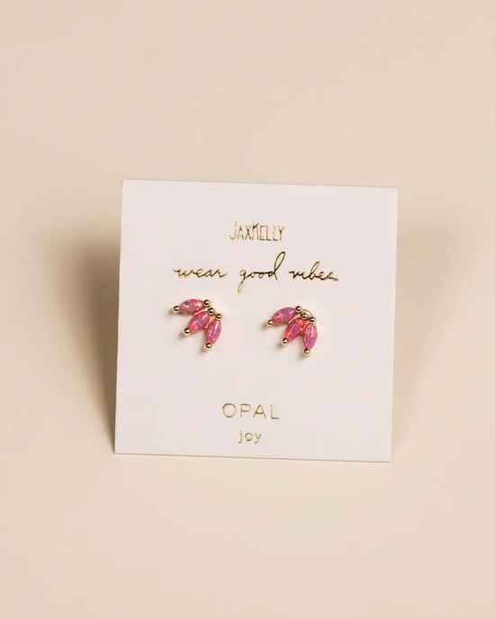 A set of JaxKelly Opal Crown Stud - Pink earrings on a display card with the text "wear good vibes - opal joy.