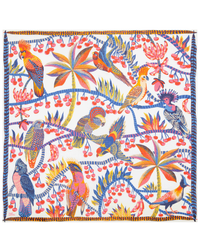 A colorful Inoui Editions Square 130 Cerise in White bandana featuring a vibrant pattern of exotic birds and tropical plants.