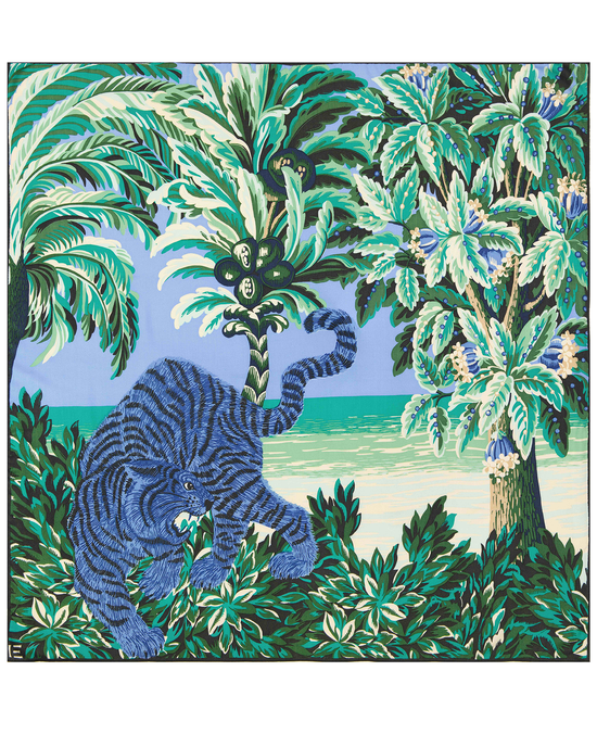 A stylized illustration of a blue elephant amidst green tropical foliage with a lake in the background, imprinted on a luxurious Square 100 Chatou in Mint scarf by Inoui Editions.