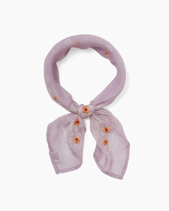 Tiny Emb Flower Bandana in Winsome Orchid tied in a knot on a white background.