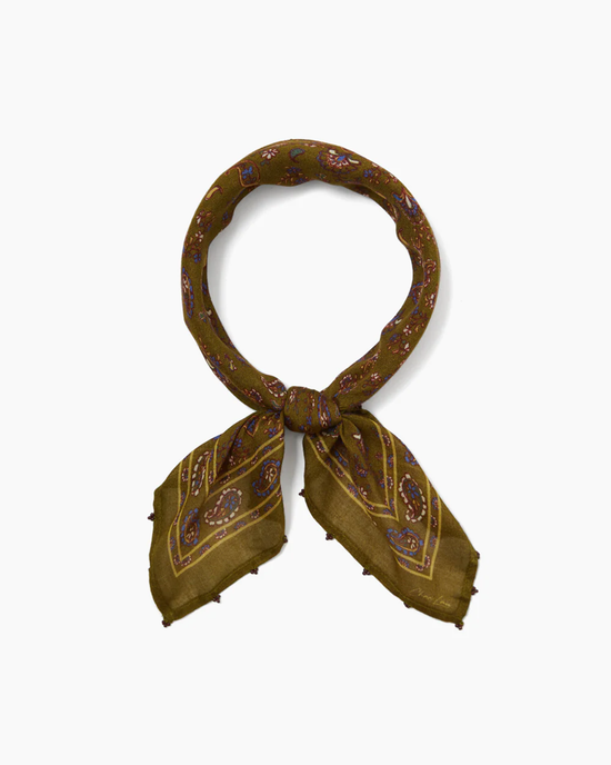 Olive-green viscose gauze scarf with Chan Luu Paisley Bandana in Grass Roots tied in a knot.