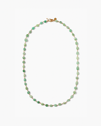 A green Santa Fe Necklace in Chrysoprase with a gold clasp on a white background by Chan Luu.