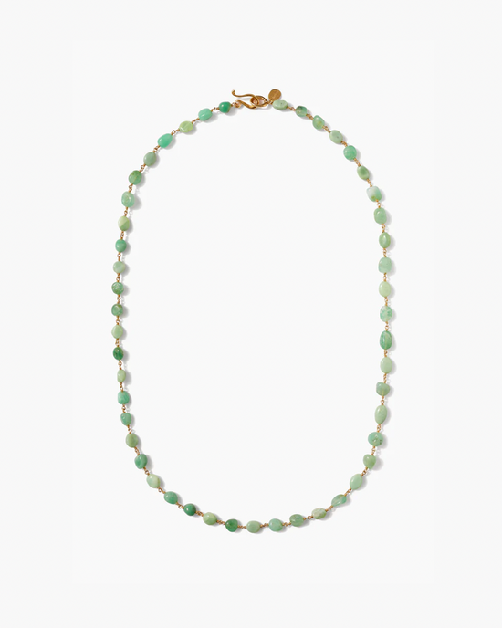 A green Santa Fe Necklace in Chrysoprase with a gold clasp on a white background by Chan Luu.