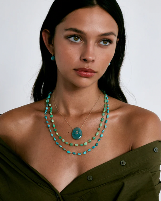 A woman wearing a layered turquoise and Chrysoprase Chan Luu Santa Fe Necklace.