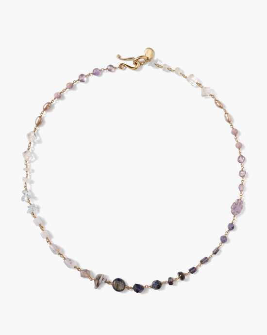 A Chan Luu Daphne Beaded Necklace in Iolite Mix with an 18k gold plated sterling silver clasp on a white background.
