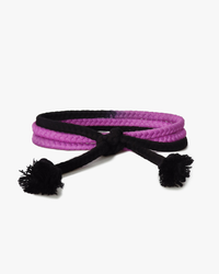 A pink and black braided headband with black tassels on a white background. One Size Fits All.