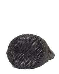 A close-up of Dragon Diffusion's Cannage Bucket - Big in Black, reminiscent of cannage weave, resting on its side against a white background.