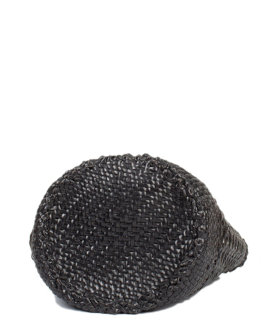A close-up of Dragon Diffusion's Cannage Bucket - Big in Black, reminiscent of cannage weave, resting on its side against a white background.