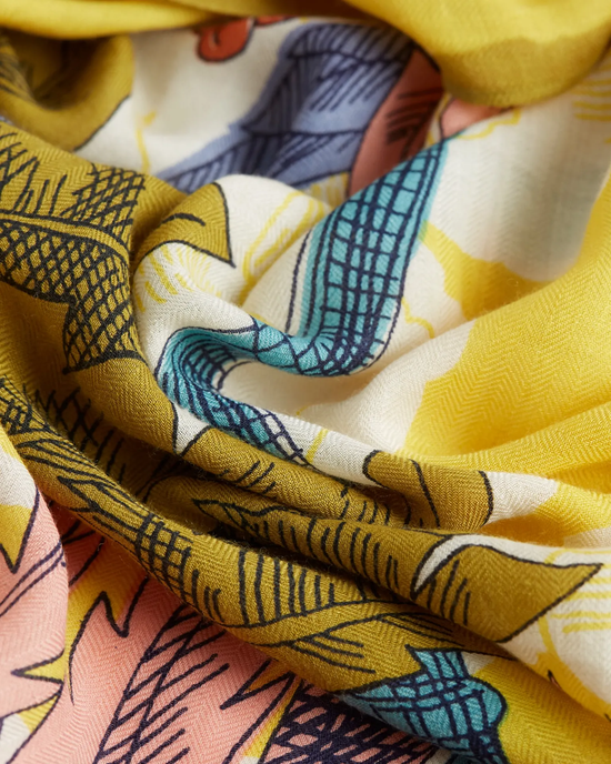 Close-up of a colorful, Inoui Editions Square 130 Robinson silk cashmere blend fabric with yellow, blue, and pink tones.