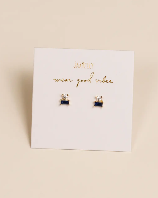 A pair of Sapphire Double Stack studs shaped like typewriters, displayed on a card with the text "JaxKelly wear good vibes".