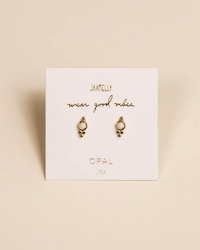 A pair of Tri Ball Studs - White Opal with JaxKelly White Opal earrings on a display card with the inscription "wear good vibes" and "opal joy" by JaxKelly