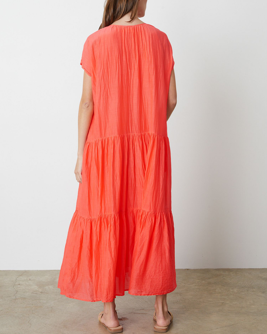A person wearing a Dolly Ada Flounce Tier Dress by Velvet by Graham & Spencer viewed from the back.