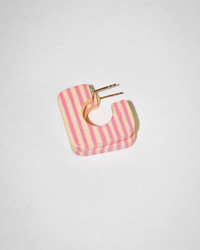 A Square Hoop in Mini in Peter Rabbit hair clip by B&L, hand carved from sustainably sourced mango wood, placed on a white surface.