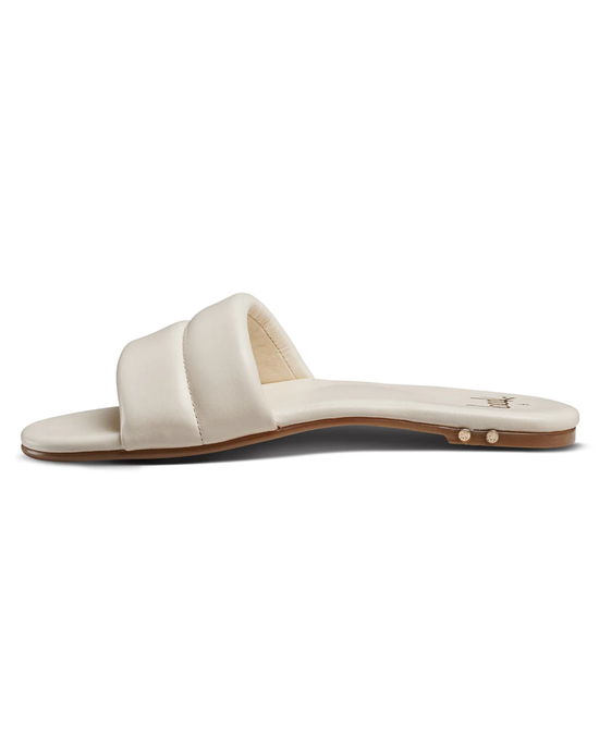 A single Sugarbird in Eggshell flat slide sandal from beek., with a molded footbed, photographed against a white background.