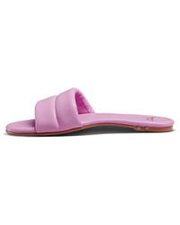 A single Sugarbird in Lilac slide sandal with a molded footbed against a white background from beek.